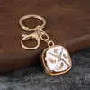 Llavero cuadrado de esmalte estilo étnico con incrustaciones de diamantes, colgante para bolso de aleación con patrón de esmalte, regalo de recuerdo de viaje al por mayor