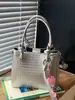 Bolso de cubo de mano minimalista de nicho Shuai Mi Jia 2026 verano nuevo estilo coreano moderno y a la moda bolso de hombro cruzado