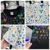 Moda Nueva de Verano Lujo Ligero Estampado Completo Letra Manga Corta Hombre Tendencia Suéter Casual Elegante Versátil Cuello Redondo Media Manga