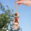 Campanilla de mano con forma de cáscara de fruta indonesia de planta natural, colgante para bolso, instrumento de terapia de sonido curativo, carillón de viento, adorno para colgar en el coche, llavero