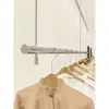 Estante de exhibición para tienda de ropa, barra colgante elevable, barra colgante de acero inoxidable, cable de exhibición plateado para ventana, estante de exhibición ajustable
