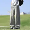 Calça Jeans Masculina Vintage Estilo High Street Americano Nova Tendência Marca Primavera e Verão Calça Longa Solta de Perna Reta para Jovens Homens Verão