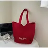 Bolsa de mano tipo tote simple de estilo coreano al por mayor para mujer 2025 Verano Nuevo Gran Capacidad Hombro Único Lona Versátil Bolso de Axila