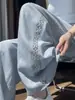 Foto real de los nuevos pantalones anchos de verano 2026 de Tencel y lino, pantalones casuales de cintura alta adelgazantes, pantalones rectos hasta el suelo de seda helada para mujer