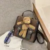 2026 Nueva Bolsa Linda de Dibujos Animados Mochila Retro de Oso para Mujer para la Escuela Mochila Versátil para el Viaje Diario