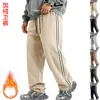 Venta al por mayor transfronteriza de Amazon de pantalones casuales holgados con cordón, bloques de color, forro polar de peso pesado para otoño e invierno para hombre