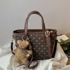 Bolso de Mano Retro para Mujer 2026 Nueva Moda de Otoño Nicho Súper Popular Bolso de Hombro para el Trabajo Bolso Cruzado Tipo Cubo