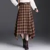 Falda Asimétrica de Cuadros Retro para Mujer 2026 Otoño Nueva de Cintura Alta Versátil de Línea A con Caída de Longitud Media Moderna