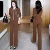 Elegante traje de mujer 2026 otoño nuevo elegante que rejuvenece top de retazos a rayas y pantalones de pierna ancha elegante conjunto de dos piezas moderno
