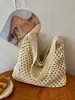 Bolsa de Palha Casual de Grande Capacidade para Mulheres 2026 Novo Estilo Bolsa de Ombro Vazada Estilo Preguiçoso Fashionável Elegante Bolsa de Praia para Férias