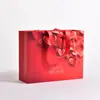Bolsas de cartón blanco personalizadas para tiendas de ropa, ópticas, bolsas para empaque de cosméticos, bolsas de regalo y bolsos al por mayor personalizados