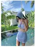 Traje de baño a rayas de alta gama transfronterizo para mujer, conjunto de cuatro piezas, estilo coreano Ins para resort de aguas termales