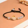 Pulsera de conejo de jade Hetian natural cuerda de mano tejida de ágata blanca diseño de nicho estilo chino cuerda roja para año de nacimiento