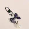 Colgante de macarrón con lazo de moda accesorio para teléfono con corbata de lazo para llaves accesorio para funda de auriculares accesorio para bolsa y ropa regalo para estudiante