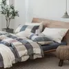 Juego de cuatro piezas de algodón 100% teñido en hilo y lavado, algodón puro, sin marca, suministrado por el fabricante, funda de edredón de alta calidad, sábana bajera de estilo japonés, ropa de cama al por mayor