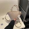 Bolso pequeño tipo cubo para mujer, bandolera con textura nueva de 2023, bolso francés con forma de corazón para niña, bolso bandolera informal.