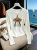 Elegante camiseta de manga larga ajustada para mujer, nuevo modelo otoño 2026, simple y chic, versátil, color albaricoque, top de algodón puro