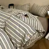 Nuevo conjunto de cuatro piezas de algodón y lino estilo botón simple de lujo ligero, estilo minimalista de Instagram, conjunto de tres piezas de hilo de rizo de algodón puro para ventas transfronterizas