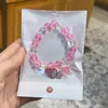 Libro Caperucita Roja Mismo Estilo Estudiante Pulsera de Glaseado de Palomitas de Maíz Hecha a Mano con Cuentas Dibujos Animados Cristal Pulsera Infantil Venta al por Mayor Cajas de Regalo
