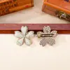Brocado Song de cinco pétalos de flor de cerezo acabado en el pecho puntada colorida tela de brocado Song broche de flor de cerezo de aleación accesorios de ropa de estilo antiguo lote mixto