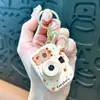 Llavero de dibujos animados creativos kappi bala de cara giratoria lindo colgante para mochila escolar llavero para llaves de coche pequeño regalo al por mayor