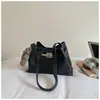 Bolso de mano tipo cubo de moda para mujer con patrón de lichi 2026 Nuevo Otoño/Invierno Bolso de hombro y cruzado versátil de alta gama