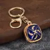 Llavero cuadrado de esmalte estilo étnico con incrustaciones de diamantes, colgante para bolso de aleación con patrón de esmalte, regalo de recuerdo de viaje al por mayor