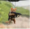 Pingente de gato plano de acrílico transfronteiriço novo segurando uma arma