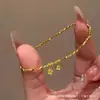 Pulseira Minimalista Dourada Flor Sino Orquídea para Mulheres, Design de Nicho, Luxo Leve, Sensação de Alto Padrão, Pulseira com Cordão Elástico Tendência
