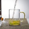 Fabricantes al por mayor de tazas de té verde de vidrio resistente al calor con tapa, taza Huiki, taza de agua de oficina de vidrio, taza de leche, juego de té de gran capacidad