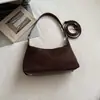 Otoño 2026 Nuevo Estilo Coreano Retro Color Sólido Simple Bolso de Hombro Tipo Dumpling Bolso de Mano para Viajes de Negocios Gamuza Bolso de Hombro de Moda