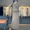 Otoño/Invierno 2026 Nuevo Suéter de Punto de Lana Pura con Cuello en V de Manga Larga para Mujer Falda Larga de Color Sólido de Cintura Alta Conjunto de Dos Piezas
