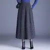 Saia xadrez de lã estilosa para mulheres, novo modelo outono/inverno 2026, cintura elástica, corte solto para corpo tipo pera, saia tulipa moderna