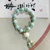 Fabricantes suministro pulsera de cachorros de cerámica diseño de nicho pulsera nuevo chino lindo cachorros huesos cuentas juguetonas