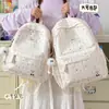 Mochila estampada elegante transfronteriza 2026 para estudiantes universitarias, mochila escolar fresca y simple para estudiantes de secundaria, mochila ligera