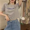Versão coreana da nova máquina de cuidados curtos solta revelou letras impressas camiseta de manga curta top feminino uma geração de cabelo
