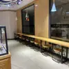 Mesa alta, estilo industrial, adecuada para tiendas de conveniencia, loncherías y bares; juego de mesa y sillas largo y estrecho diseñado para colocarse contra una pared