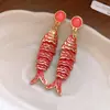 Pendientes de aguja plateada con diamantes, pendientes de botón ovalados plisados de mariposa, pendientes retro vintage con un diseño único, pendientes de nicho para mujer