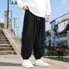 Calça casual de veludo cotelê para homens, para as estações de primavera e outono, com corte solto, plus size, apresentando design estilo chinês, cintura com cordão e cor sólida com punhos elásticos