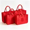 Nueva bolsa de regalo de boda roja con el carácter de "doble felicidad", bolsa de fieltro para damas de honor, bolsa de mano de fieltro para bodas, bolsa de regalo para fiestas y celebraciones
