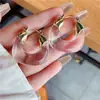 Corea del Sur Dongdaemun aretes transparentes de resina con hebilla en forma de U aretes de acrílico ámbar cosidos aretes para mujer