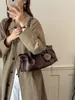 Bolsa de ombro vintage de grande capacidade 2026 nova bolsa tote de nicho estilo coreano para o dia a dia com design de cordão macio bolsa de mão