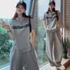 Conjunto Deportivo Casual para Mujer Verano 2026 Moda Nuevo Top de Cuello Alto Manga Corta Pantalones Largos de Pierna Ancha Conjunto de Dos Piezas Tendencia