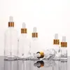 Botella vacía de subenvasado de aceite esencial cosmético transparente al por mayor botella de subenvasado de líquido de vidrio botella gotero con cabeza de plástico de 5-100 ml