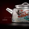 Juego de Té Chapado en Plata de las Apsaras Voladoras de Dunhuang: Una tetera y dos tazas, juego de té Kung Fu portátil para viajar, perfecto como regalo de inauguración para personas mayores