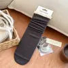 Calcetines de punto de color liso con ribete de encaje hasta la mitad de la pantorrilla estilo Dongdaemun coreano para mujer, estilo japonés de otoño e invierno, calcetines holgados rojos de Ankora dulces y retro