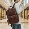Mochila Escolar de Couro PU Retrô 2026 Nova Tendência Cool Mochila de Grande Capacidade Versátil Bolsa para Roupas de Trabalho Viagem Computador
