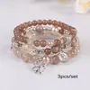 Pulsera de cuentas estilo bohemio con colgantes de corazón y trébol de cuatro hojas, hecha a mano, joyería ajustable, ventas directas de fábrica