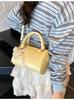 Bolso de Mano Pequeño Texturizado Transfronterizo para Mujer 2026 Estilo Nuevo de Primavera Bolso Cruzado de Hombro Único de Cilindro Moderno Sencillo