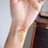 Collar con colgante de golondrina dorada para mujer, estilo chino nuevo, con el carácter "feliz" y borlas, lujo ligero, elegante, exquisito, cadena de clavícula de nicho